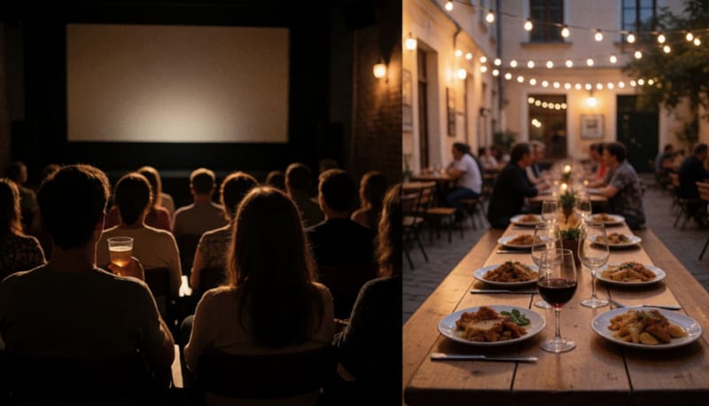 Público sentado de espaldas en una sala de cine tenue, junto a una mesa de madera con platillos y copas bajo luces cálidas